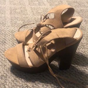 Platform heeled strappy lace up sandals